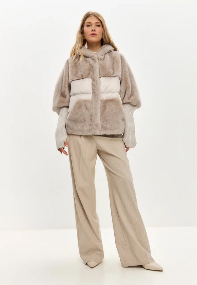 A stylish plus size ivory faux fur coat, the perfect oversized jacket for trendy winter outerwear fashion for women.