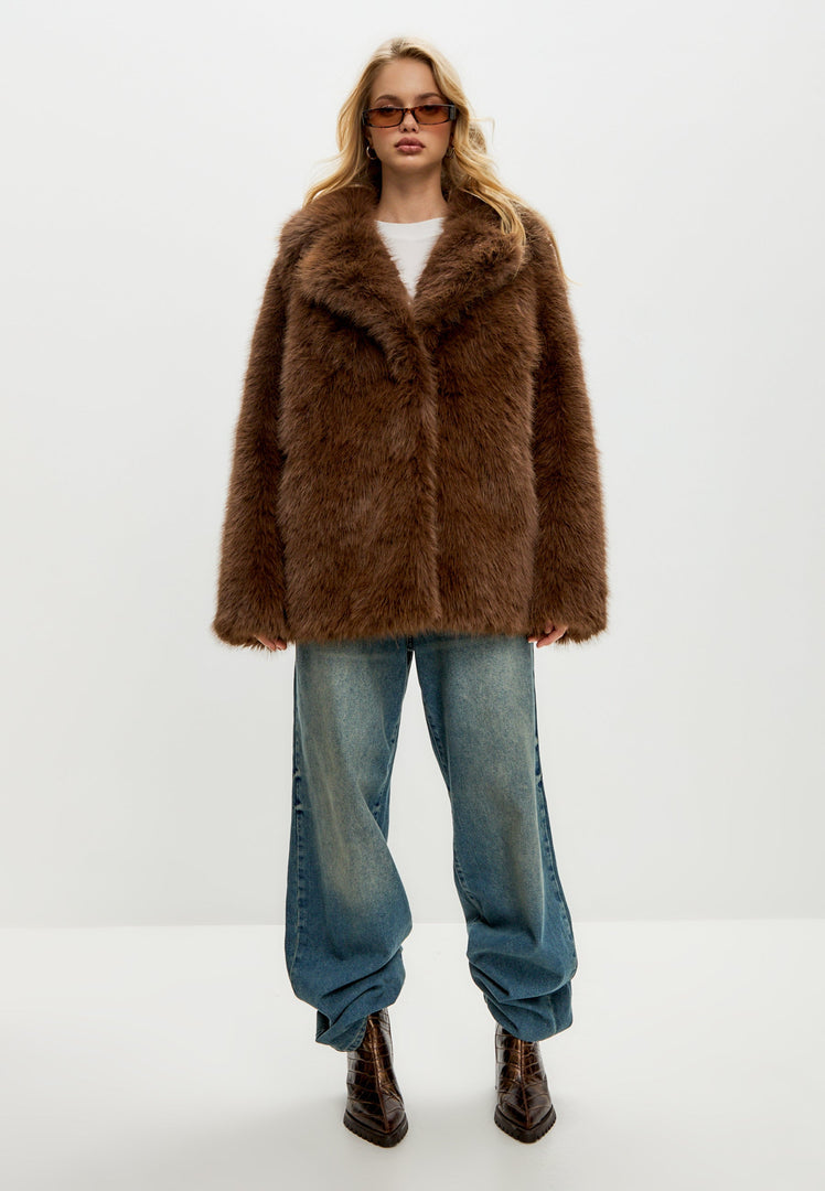 Stay warm and stylish this winter with a faux fur Betty coat, a classic short coat perfect for your winter outerwear collection in women's fashion.