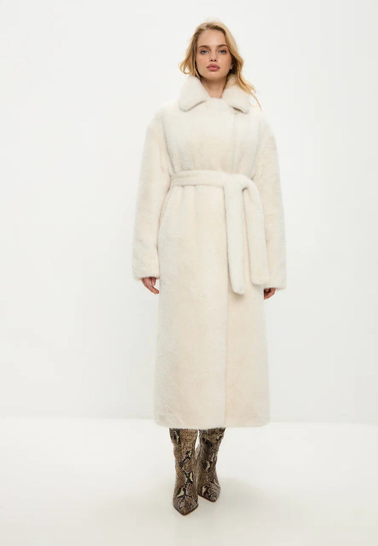 Stay warm in style with this luxurious Freya white faux fur coat, the perfect high-end winter outerwear for an elegant look.