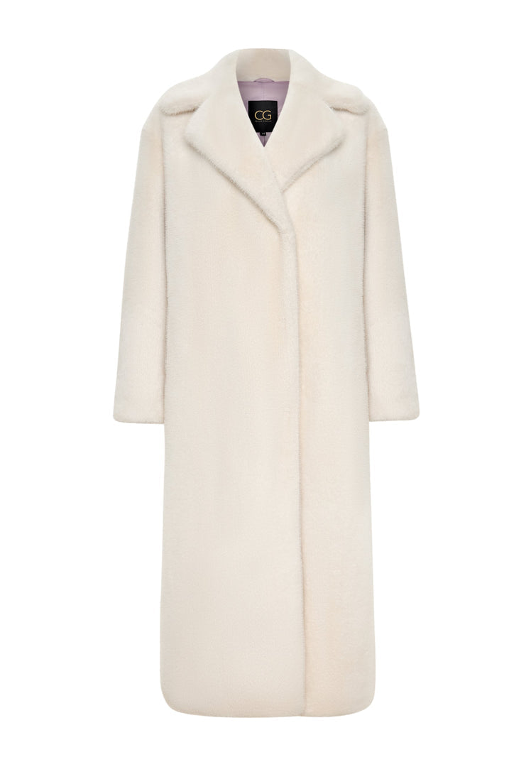A woman stylishly embracing winter in a luxurious Freya white faux fur coat, the epitome of elegant high-end winter outerwear fashion.