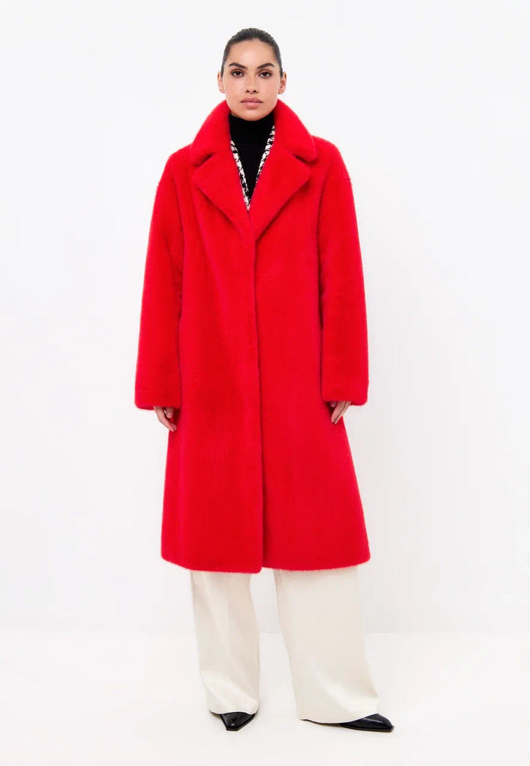 A stylish red deluxe long coat with a striking back print, perfect for coat lovers and fashion outerwear enthusiasts.