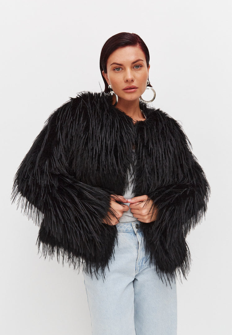 A chic black winter faux fur jacket, perfect for staying warm in style during the colder months.