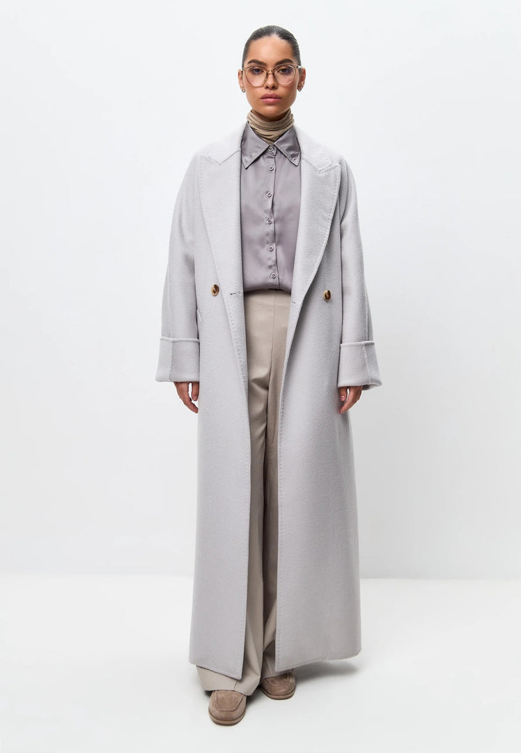 Stay warm and stylish this winter with the Classic Luxe Long Rosie White Coat - a luxury white coat that is the perfect addition to your stylish outerwear collection.