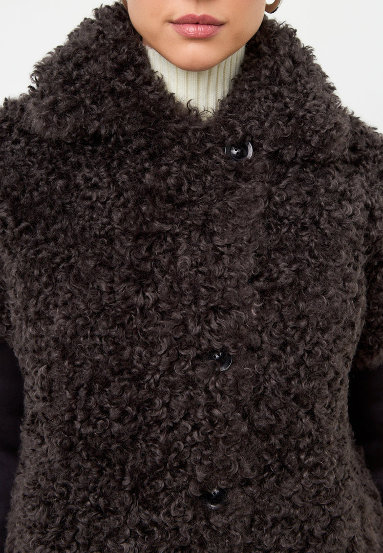 Stay warm and stylish with this cozy brown shearling Eva coat, a must-have black coat for the winter season.