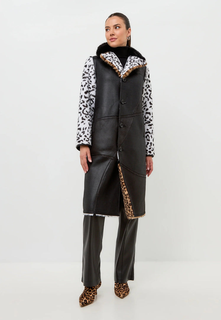 A stylish reversible faux fur Flavia coat with a chic leopard print on one side and a mixed print on the other, perfect for staying cozy and fashionable all winter long.