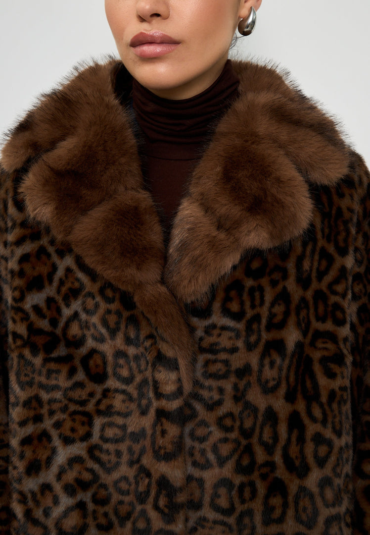 A stylish Leopard print faux fur coat from Ivy brand, boasting luxury winter fashion in chic outerwear.