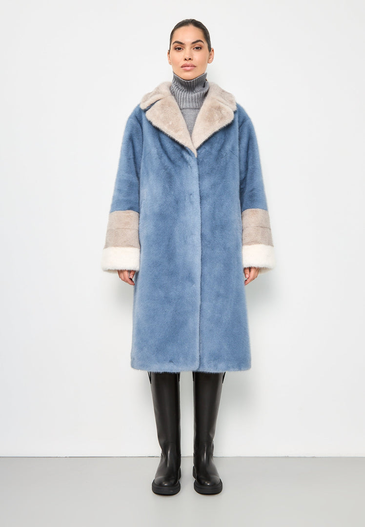 A stylish blue faux fur coat with crystal embellishments, perfect for an elegant winter fashion look.