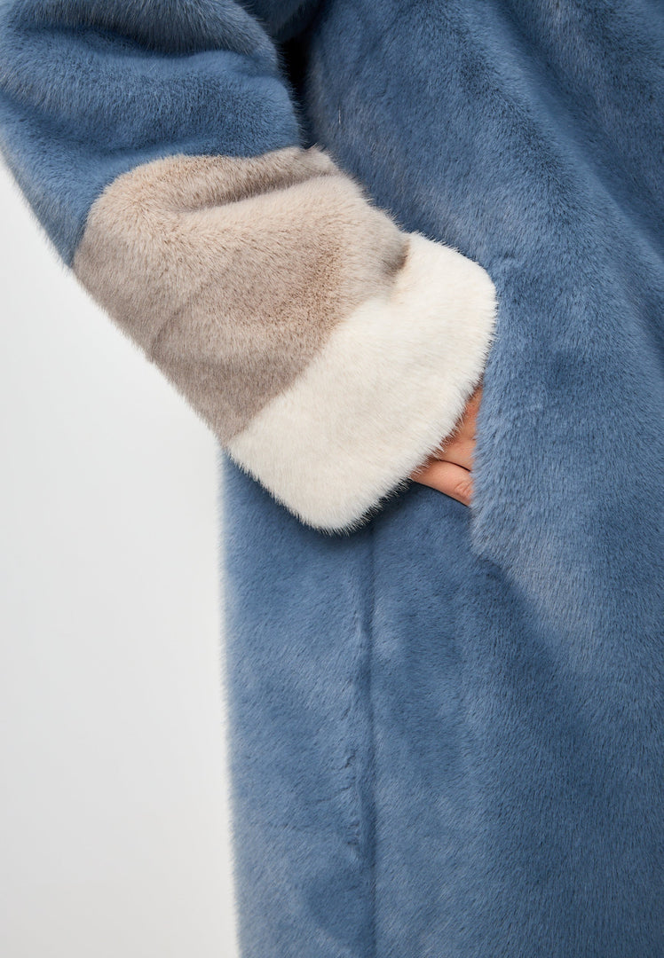 A luxurious blue faux fur coat with crystal embellishments, perfect for adding elegance to winter fashion.