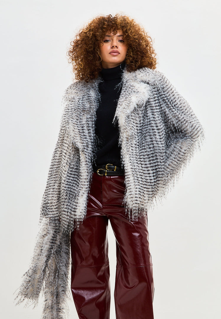A luxurious short faux fur coat in grey, known as the stylish Monica coat.