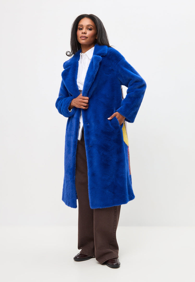 A stylish and deluxe long back print blue coat, perfect for fashion-forward women who are coat lovers and enjoy long coat fashion.