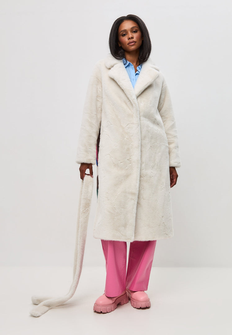 Two coat lovers wearing a deluxe print long back white coat, perfect for long coat lovers.