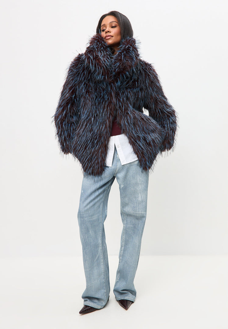A stylish Icelyn faux fur coat in luxurious blue, a must-have short coat for a touch of elegance.