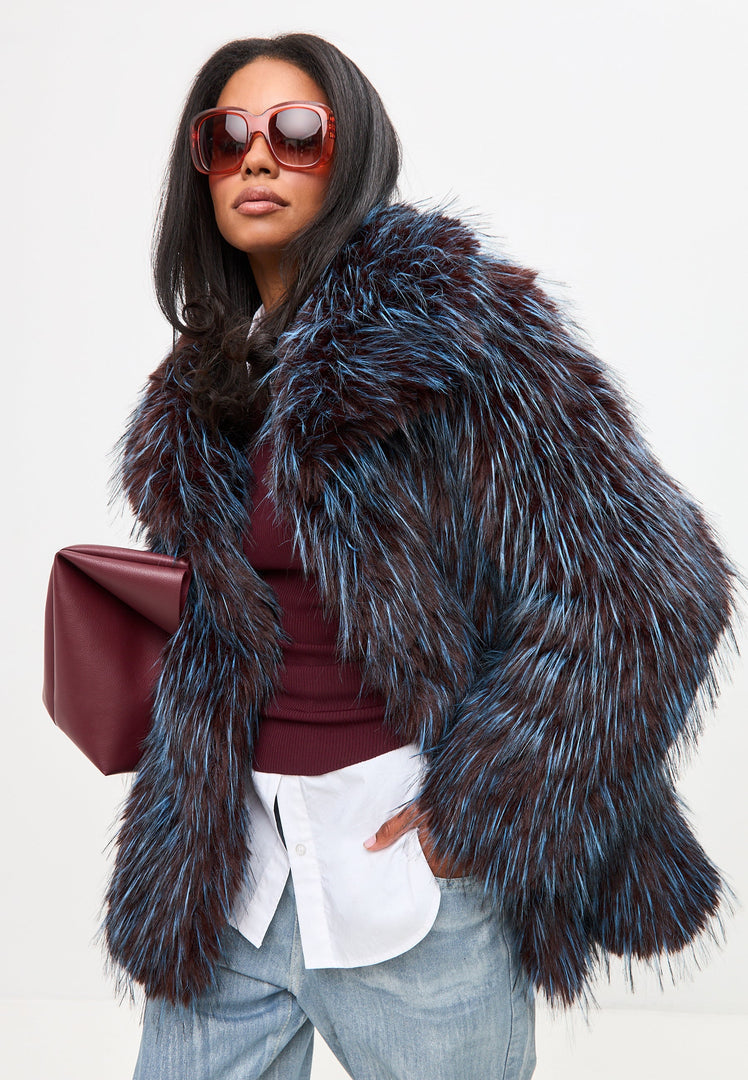 A stylish blue faux fur coat, the luxurious and short Icelyn coat perfect for adding a chic touch to any outfit.
