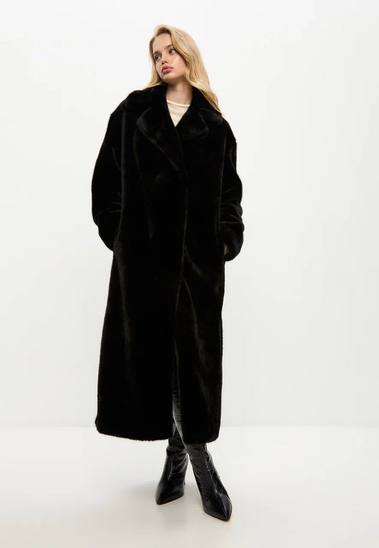 A stylish and luxurious black Freya faux fur coat, perfect for winter fashion.