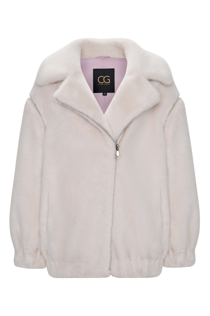 A stylish short white faux fur coat inspired by Marilyn Monroe's iconic style for a chic winter fashion look.
