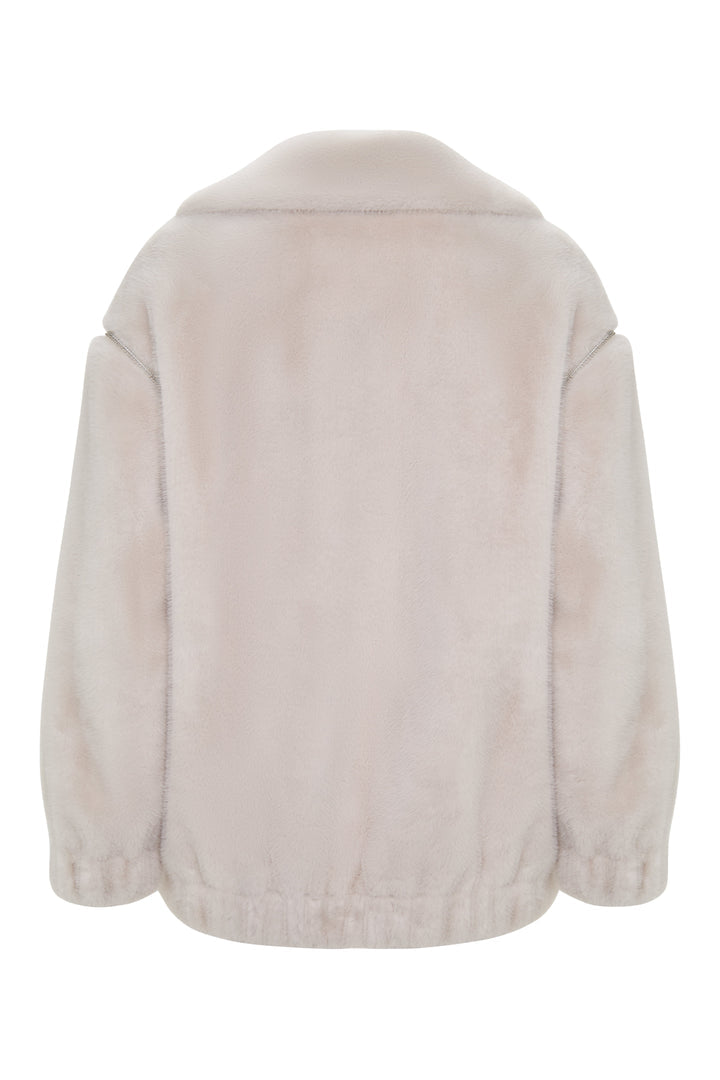A chic short white faux fur coat in Marilyn style, perfect for winter fashion.