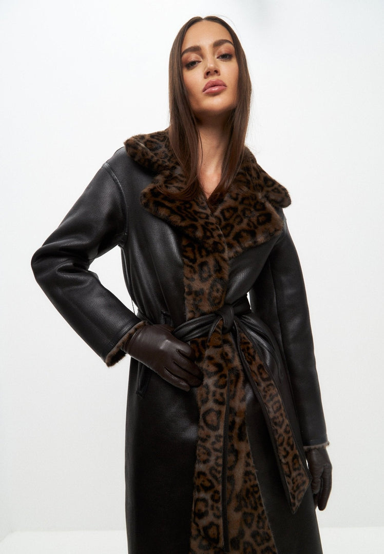 A chic and cozy reversible faux fur coat perfect for winter, featuring a long silhouette and versatile styling options for your winter outerwear collection.