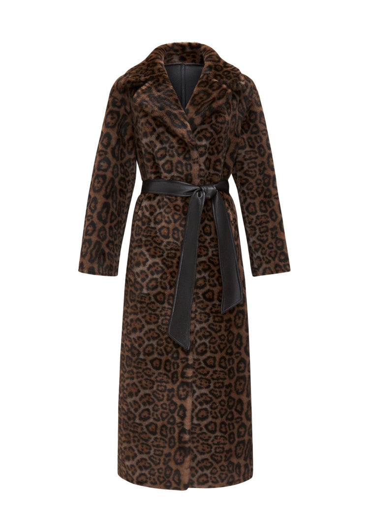 A stylish woman wearing a reversible faux fur coat, perfect for winter.