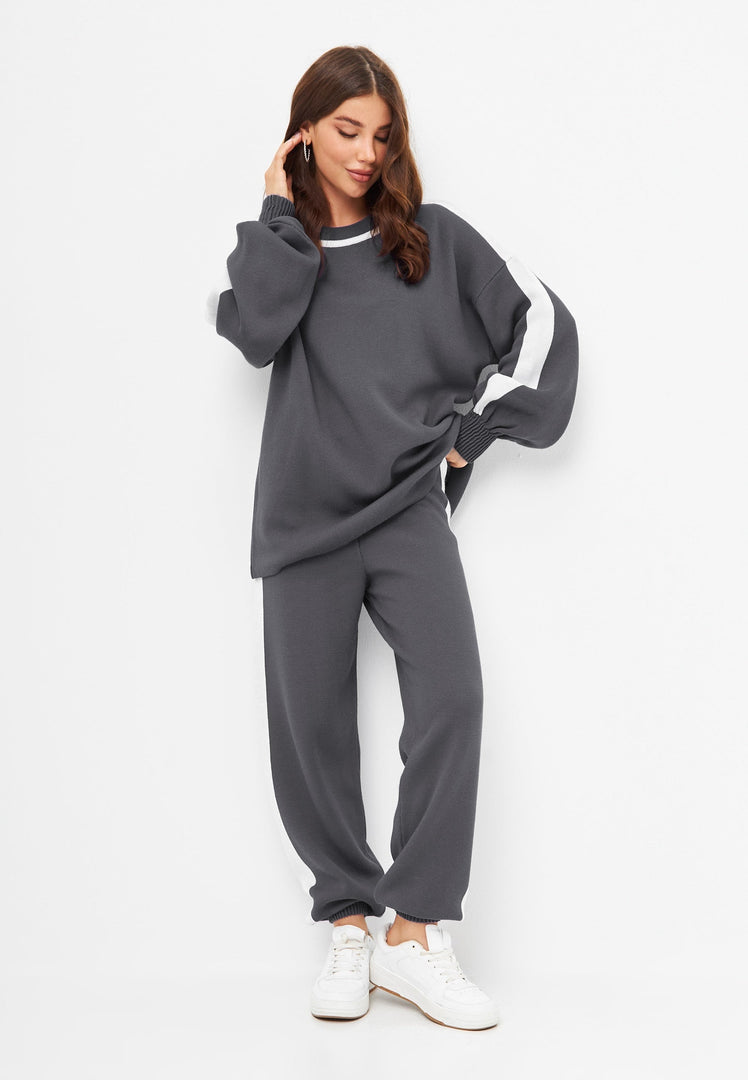 A cozy and stylish knitted jogger set in grey, perfect for a comfortable lounging outfit.