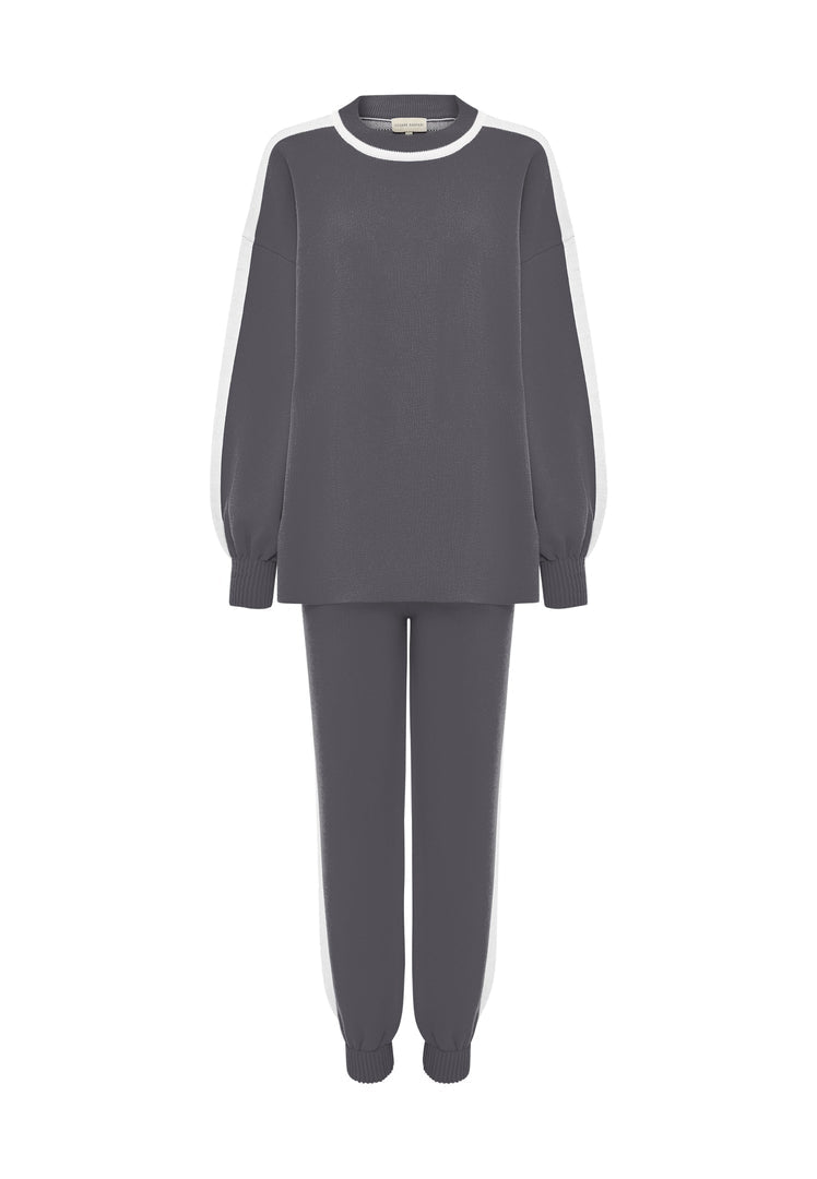 A cozy and stylish grey knitted jogger set, perfect for relaxing at home or running errands in comfort.