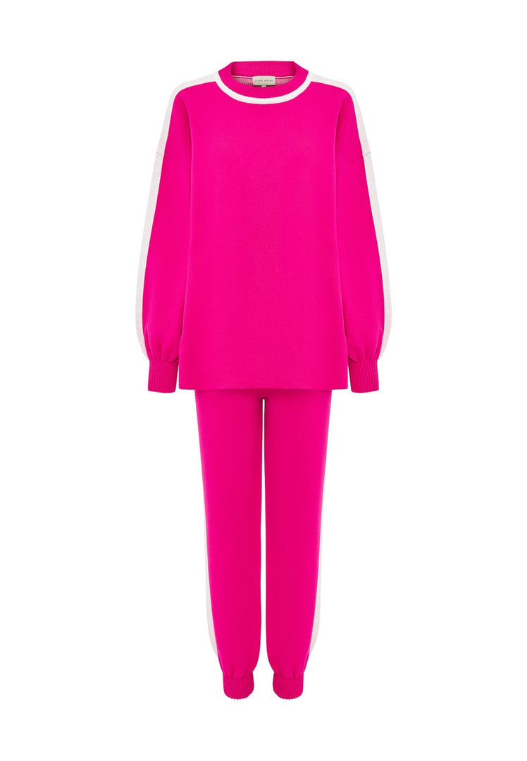 A cozy and stylish pink knitted jogger set, perfect for a casual knitwear outfit.