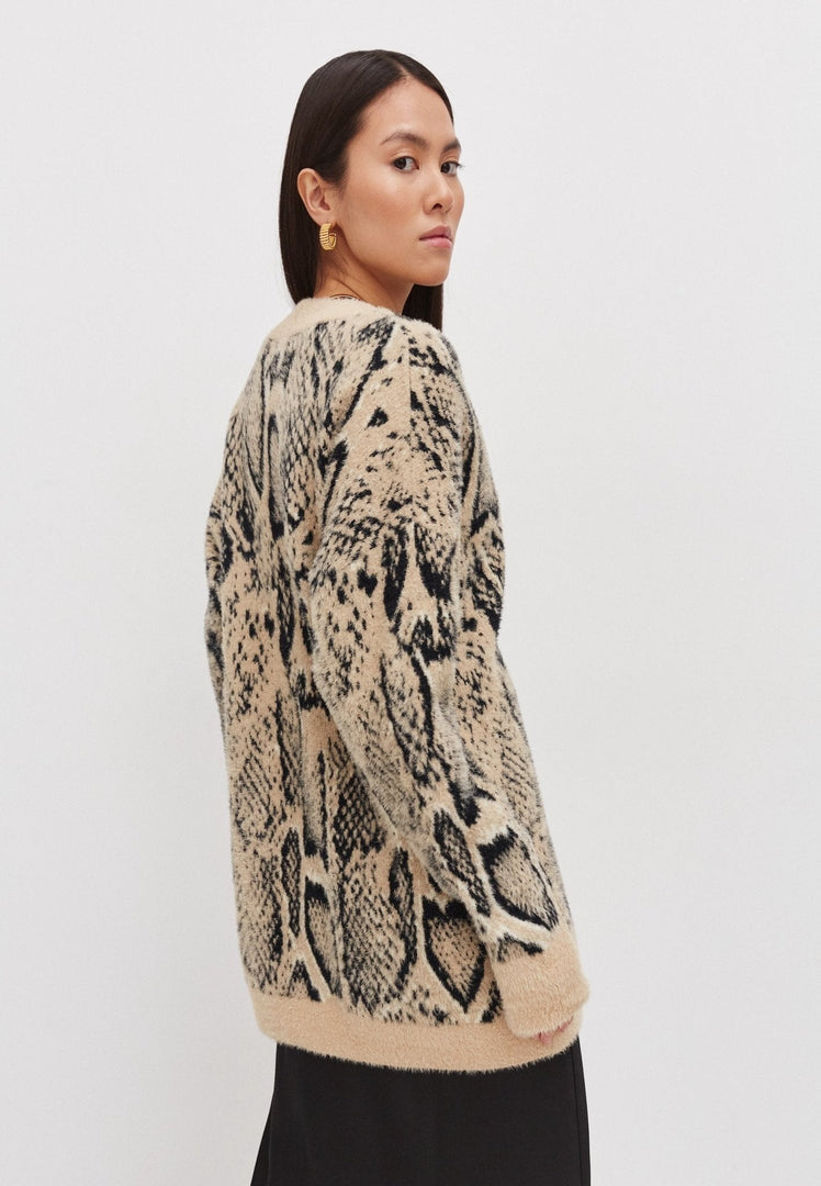 A cozy and stylish oversized chunky knit cardigan for women.