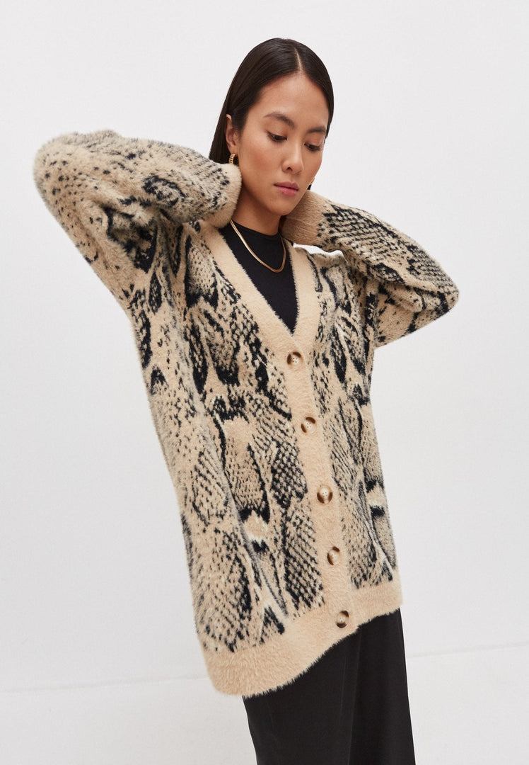 A cozy and stylish oversized chunky knit cardigan for women.
