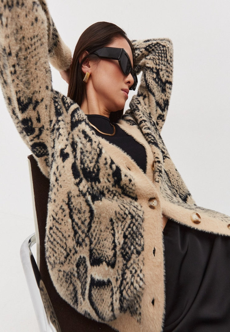 A stylish, chunky knit cardigan perfect for staying comfy and cozy in colder weather.