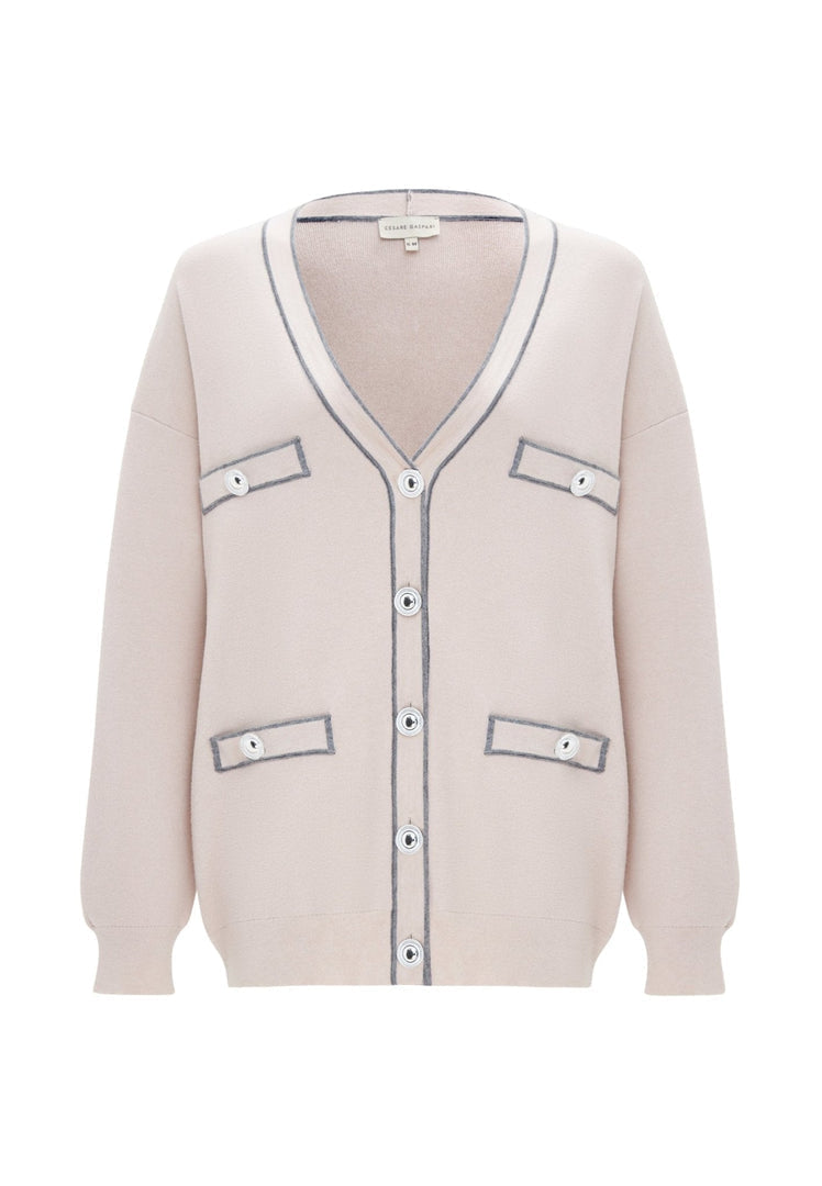 A woman wearing a cozy and stylish knit cardigan, ideal for an elegant and fashionable look.