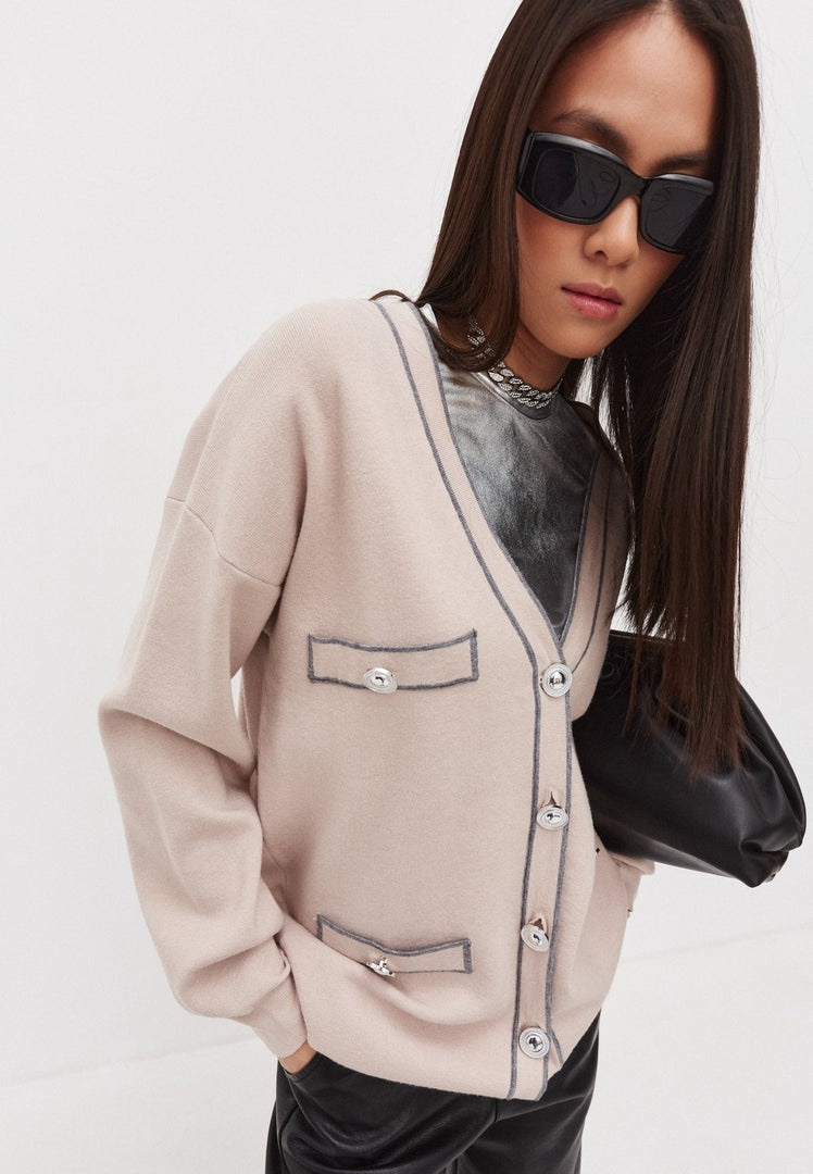 A stylish and elegant knit cardigan, perfect for staying cozy and fashionable in luxury knitwear.
