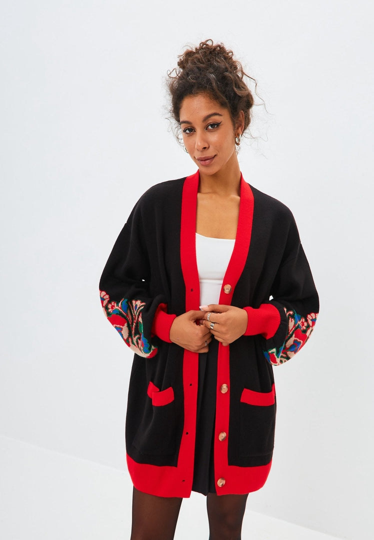 A cozy puffy sleeve oversized chunky knit cardigan, perfect for staying warm and stylish in the colder months.