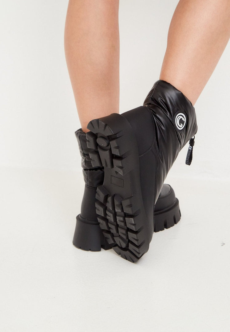 Stay warm and stylish this winter with these trendy black winter boots - the perfect blend of cozy chic and stylish winter fashion footwear.