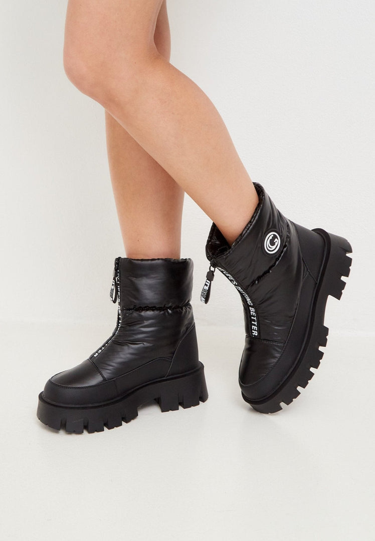 Stay cozy and chic this winter with these trendy black boots, the perfect addition to your winter fashion footwear collection.