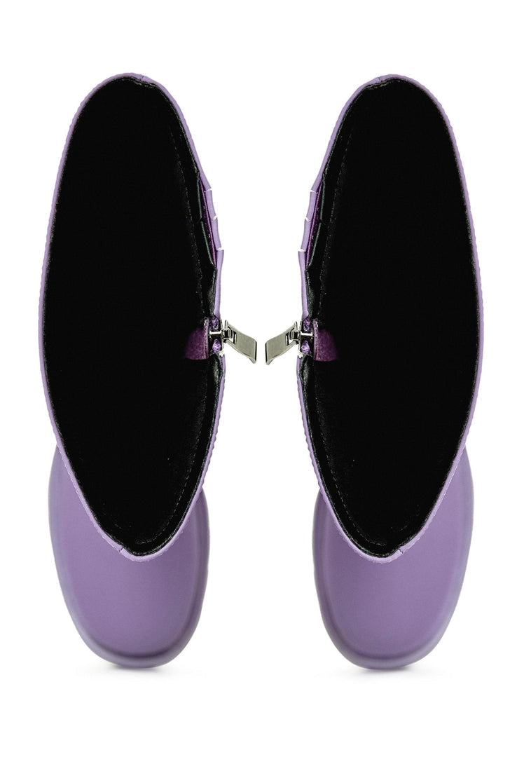 A stylish pair of chunky sole knee-high lilac boots, perfect for the fashion-forward woman looking for trendy footwear.