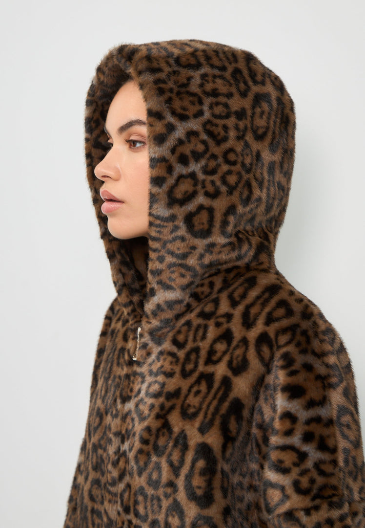 A trendy women's jacket featuring a stylish faux fur design in the Reyna leopard pattern with a hood, ideal for staying cozy and stylish in faux fur outerwear.