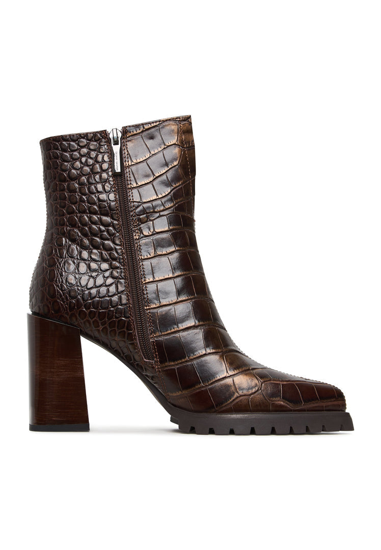 A stylish pair of brown croc block heel boots, perfect for any fashion-forward woman looking for crocodile textured boots with a trendy design.