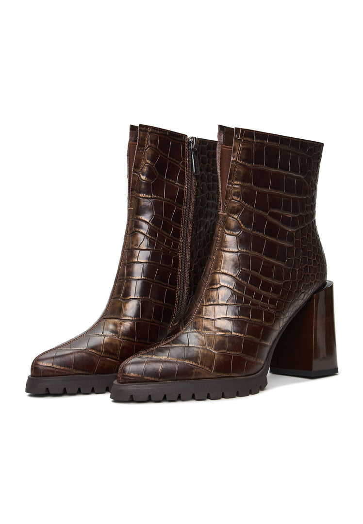 A fashionable pair of women's brown crocodile textured block heel boots, also known as Helen brown boots, featuring a stylish croc print design.