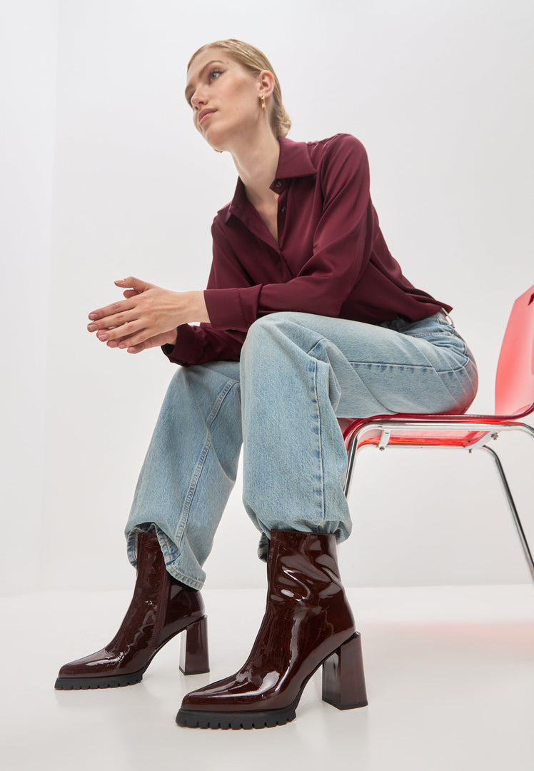 A stylish pair of red block heel Helen boots, perfect for fashionable women looking for trendy fashion footwear.