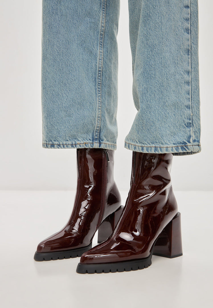 A stylish pair of red block heel Helen boots, perfect for women's fashion footwear.