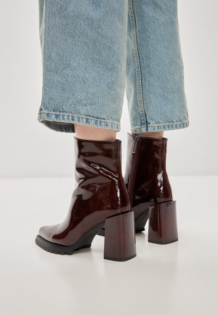 A stylish pair of red Helen block heel boots for women, ideal for adding a pop of color to your fashion footwear collection.