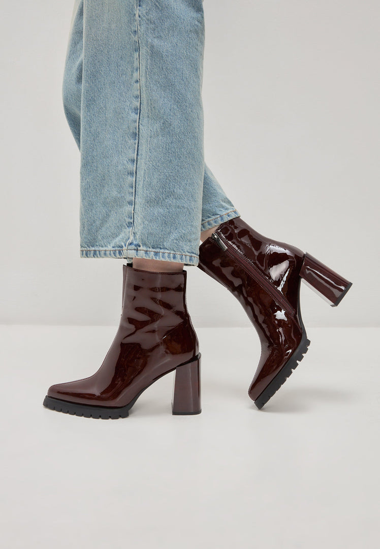A pair of stylish red block heel Helen boots for women, the perfect fashion footwear choice.