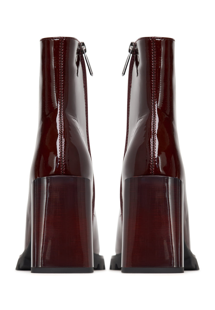 A stylish pair of red block heel Helen boots, perfect for any fashion-forward woman's footwear collection.