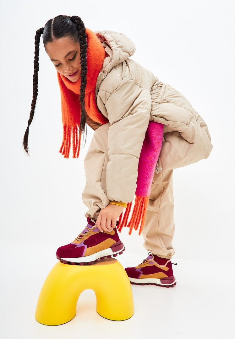 A stylish pair of chunky platform Bordeaux sneakers for women, perfect for fashion-forward looks.