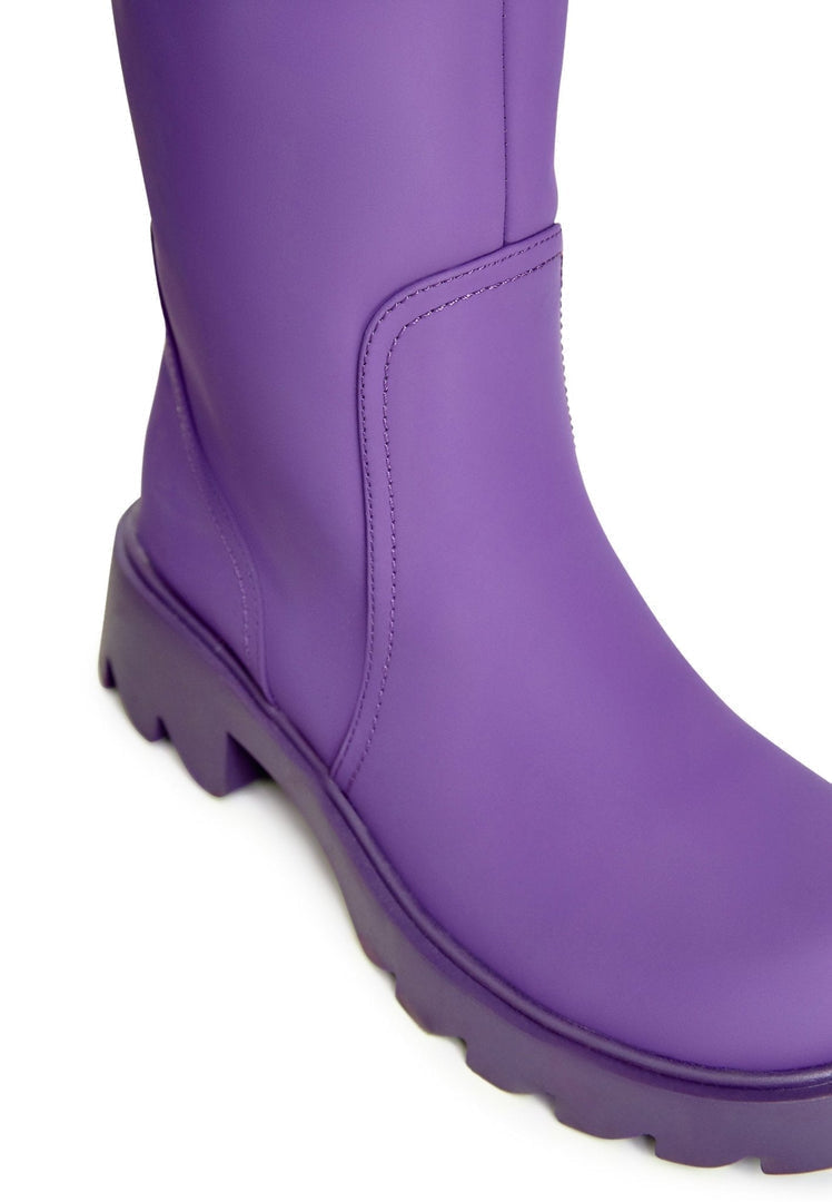 A stylish pair of chunky sole purple knee-high women's fashion boots.