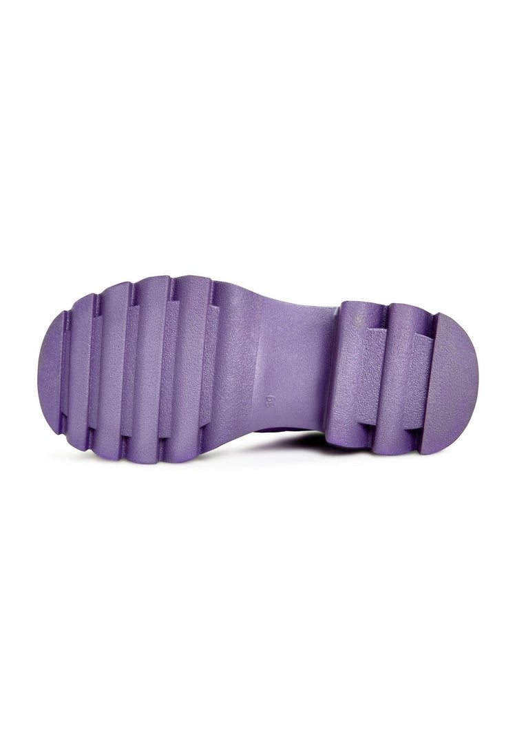A stylish pair of women's knee-high chunky sole purple boots, perfect for any fashion-forward look.