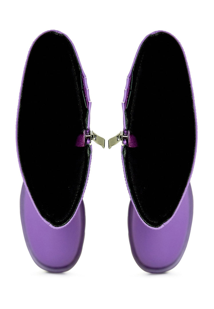 A stylish pair of knee-high chunky sole purple women's fashion boots.