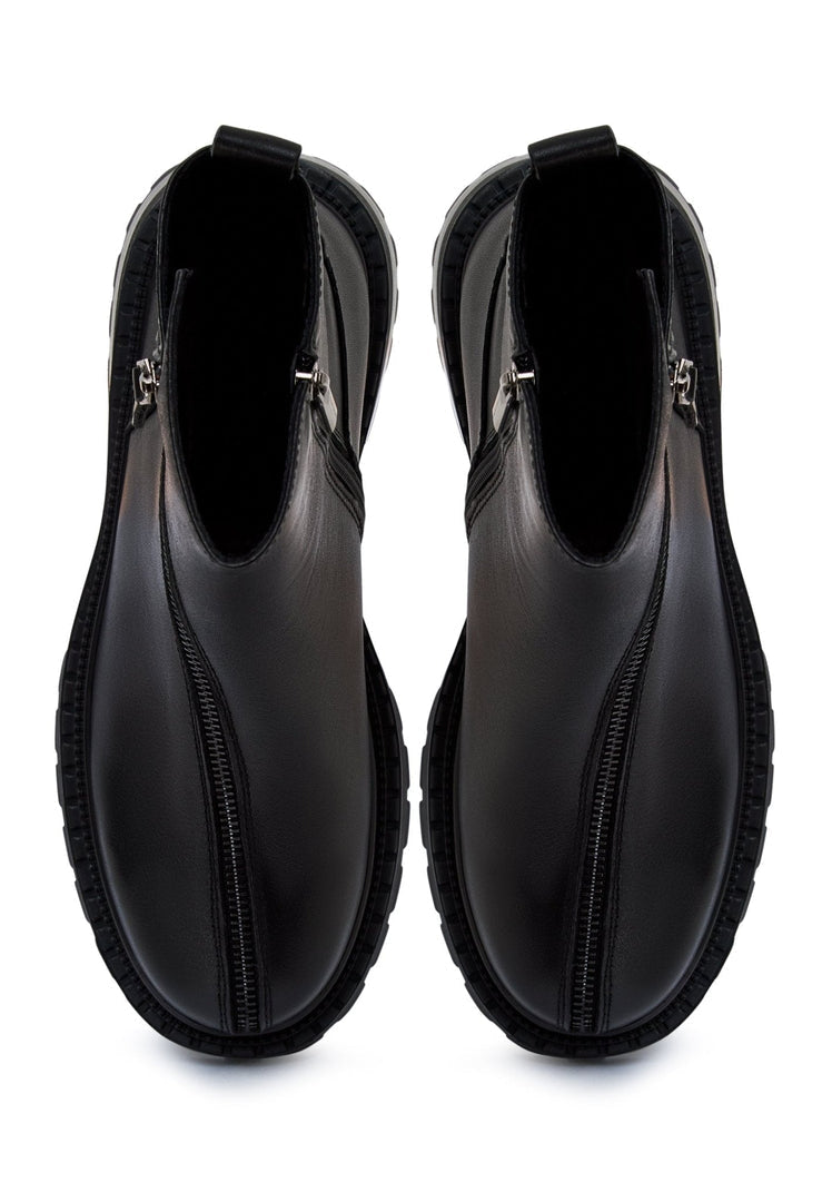 A chic pair of black leather platform ankle boots for women with high heels.