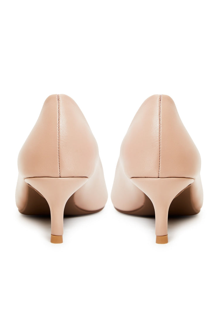 A pair of elegant pumps in beige, designer heels, luxe shoes, and fashionable stilettos.