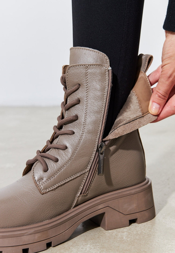 A stylish pair of brown lace-up ankle boots for women, perfect for adding a fashionable touch to any outfit.