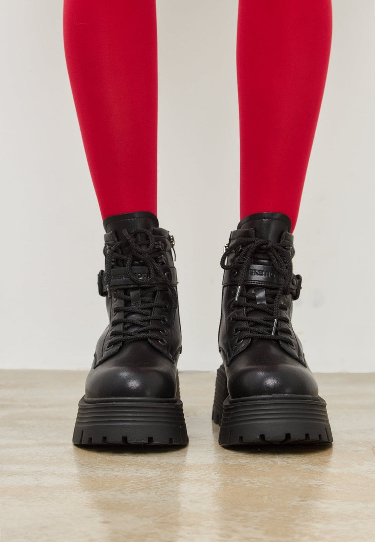 A trendy pair of black ankle boots with an elegant platform design, perfect for stylish women's footwear fashion.